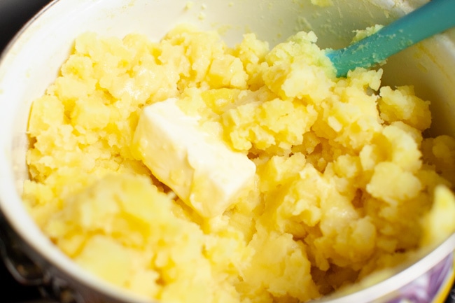 mashed potatoes in a pot with butter