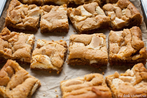 These bars are so easy to make...the crust is made with graham cracker crumbs & I used white chocolate Reese's butter cups! Peanut Butter Cookie Pie Bars from thelittlekitchen.net