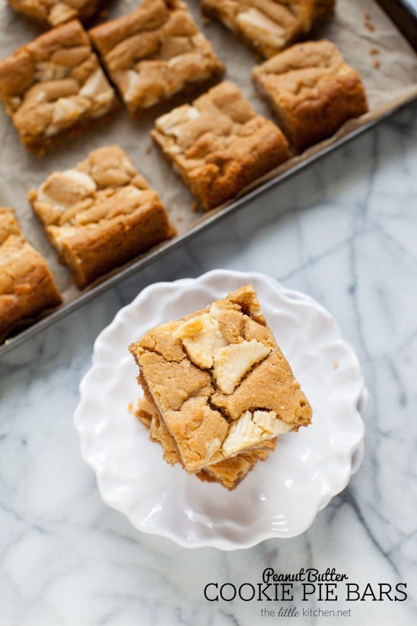 These bars are so easy to make...the crust is made with graham cracker crumbs & I used white chocolate Reese's butter cups! Peanut Butter Cookie Pie Bars from thelittlekitchen.net