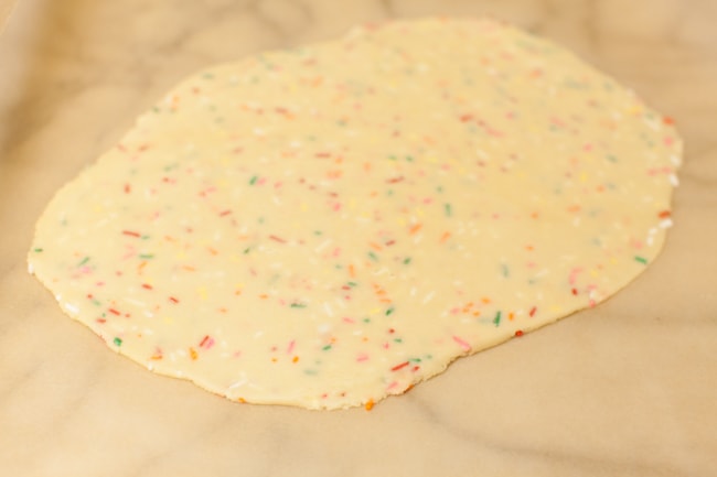 Yellow Heart-Shaped Rainbow Funfetti Cookies from thelittlekitchen.net