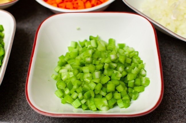chopped celery and other vegetables in the background