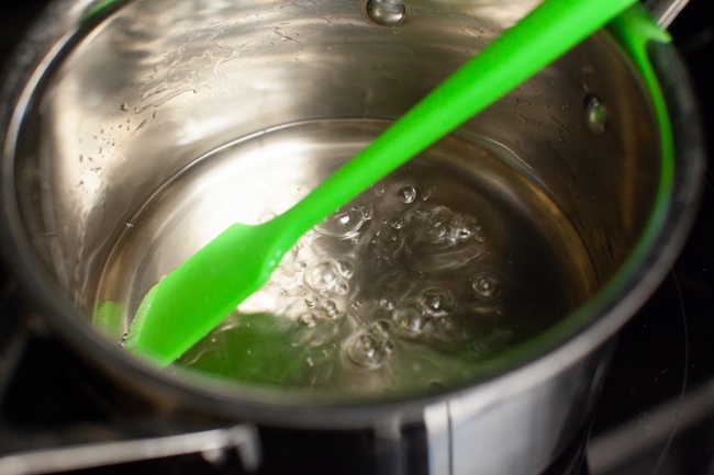 simple syrup bubbling in a saucepan