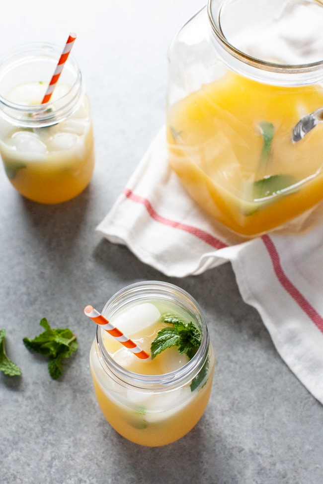 orange mint tea in mason jars and fresh mint