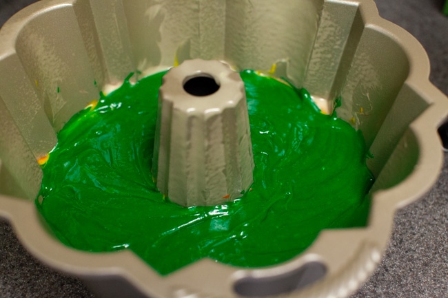 Green cake batter in Bundt cake pan