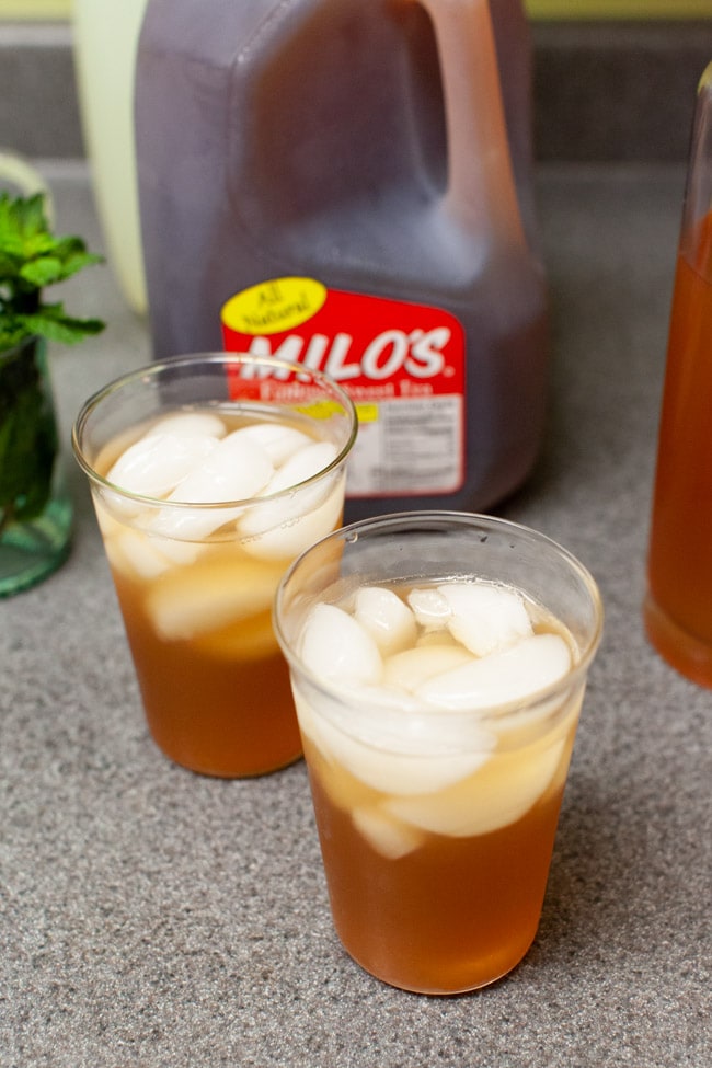 two glasses of iced tea with vodka and lemonade on a kitchen counter