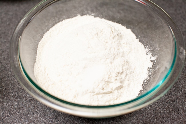 Flour and salt mixed together in glass bowl for Matcha Cookies from thelittlekitchen.net