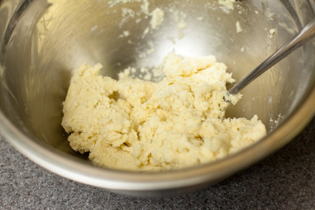 Pie crust dough in metal bowl