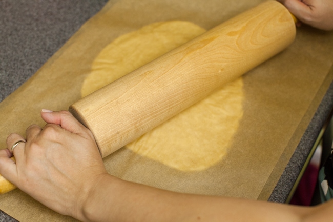 Rolling Sugar Pie crust between sheets of parchment paper
