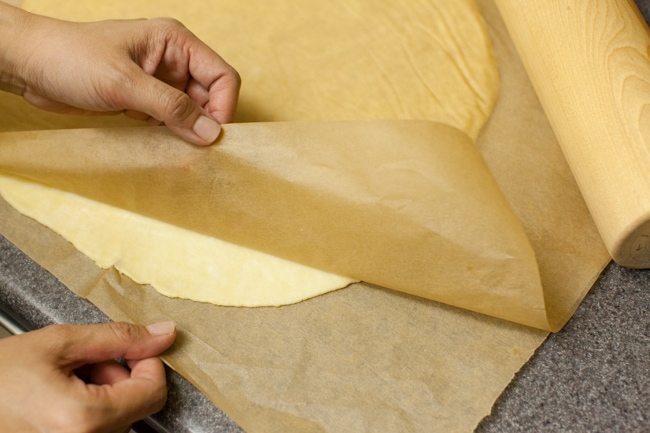 Rolling Sugar Pie crust between sheets of parchment paper