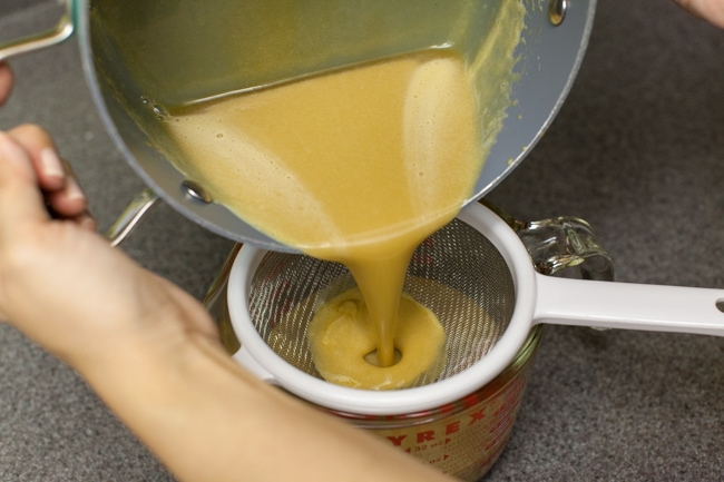 Pouring Sugar Pie filling through strainer