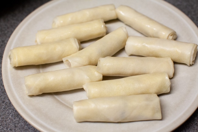 egg rolls sprayed with olive oil on a plate