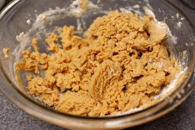 Peanut Butter Blossom Cookie Dough in a glass bowl. 