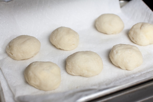 stuffed bagel bites after boiling on a paper towel lined baking sheet