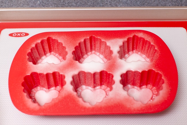 heart shaped baking pan on baking sheet