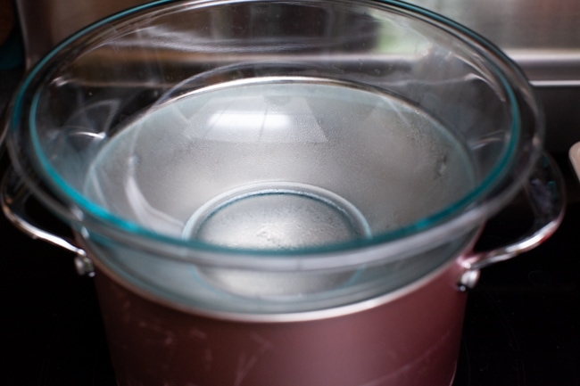 glass bowl on top of a pot