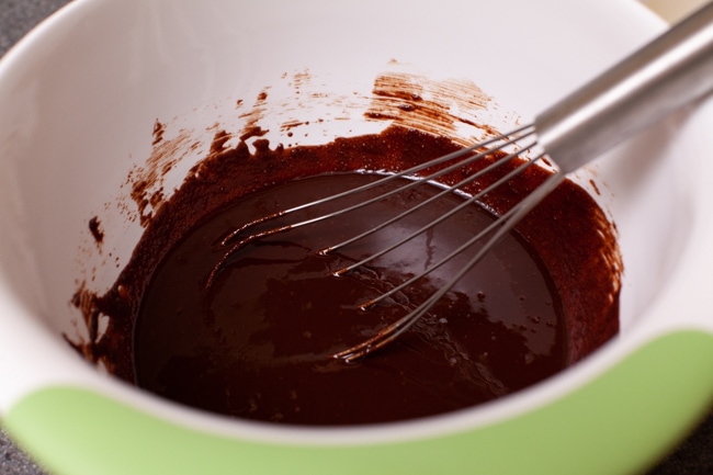 whisk in a bowl with chocolate