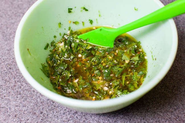 cilantro lime marinade for chicken in a green mixing bowl