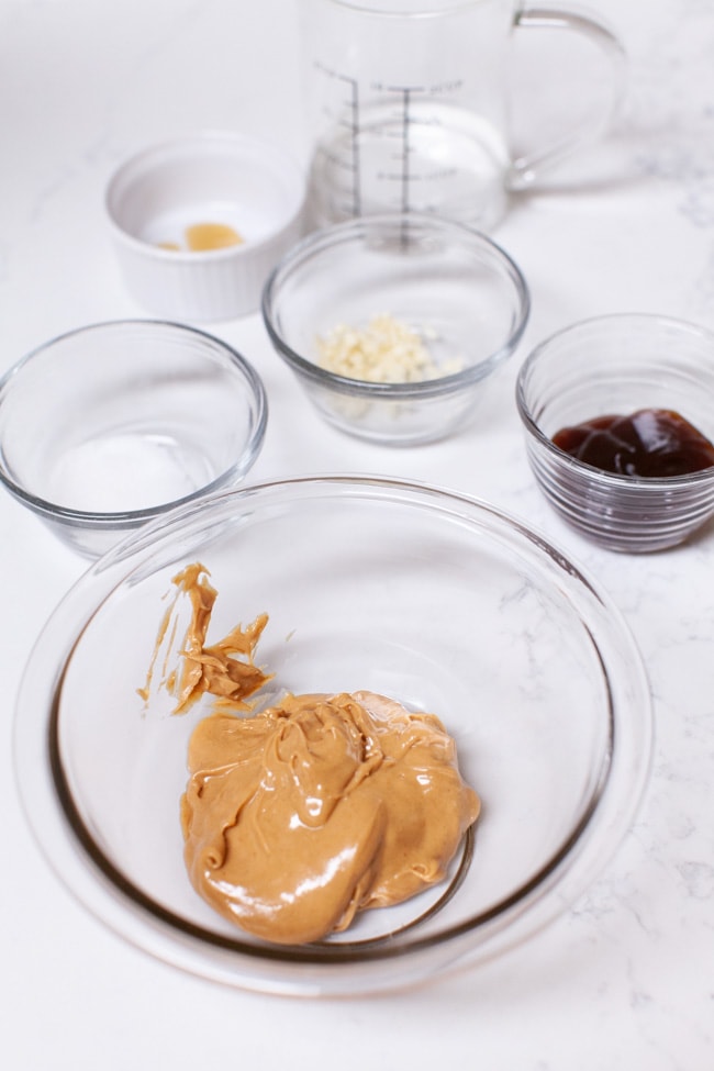 ingredients for peanut sauce arranged in bowls