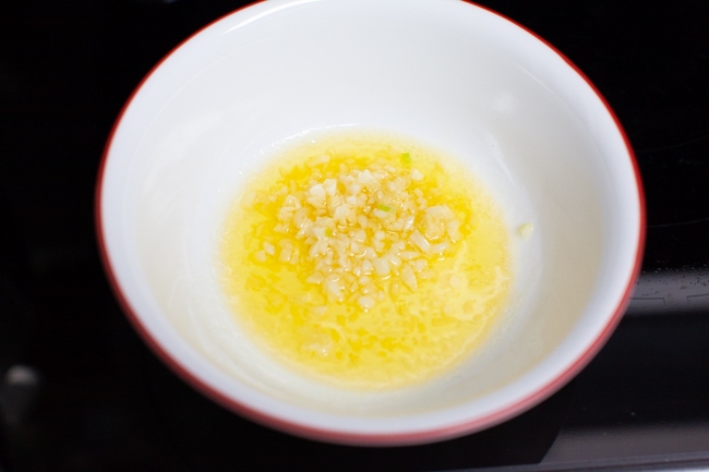 garlic and melted butter in a bowl