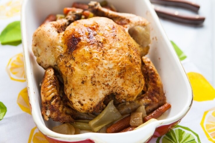 whole chicken in a baking dish