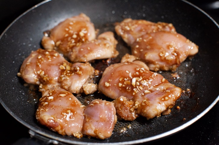 lemongrass chicken cooking in a nonstick skillet