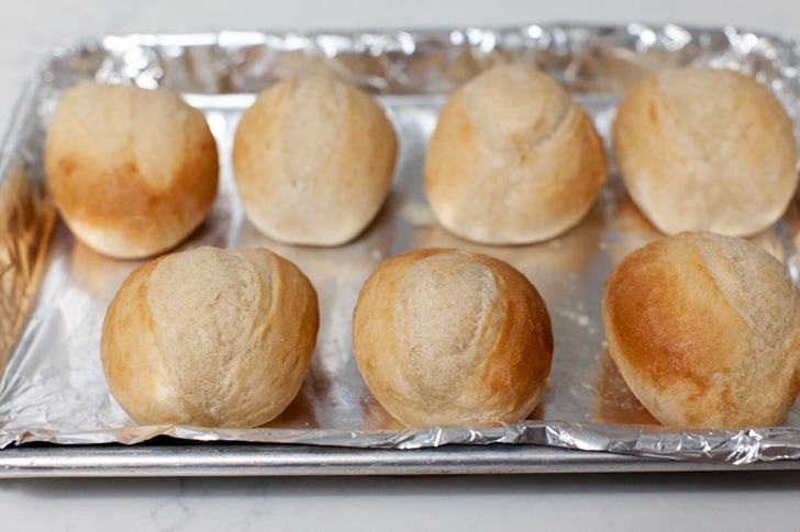 rhodes warm & serve rolls on a baking sheet