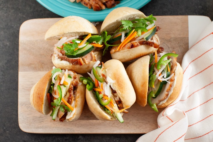 chicken banh mi sliders on a wooden board 