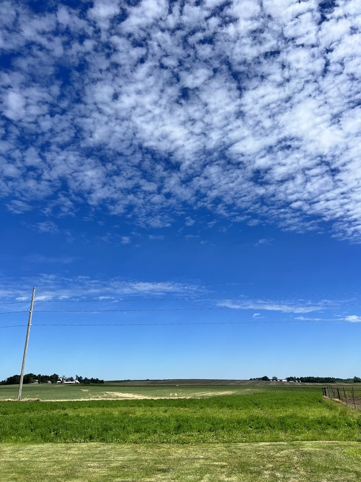 Iowa farm =with a beautiful blue sky background